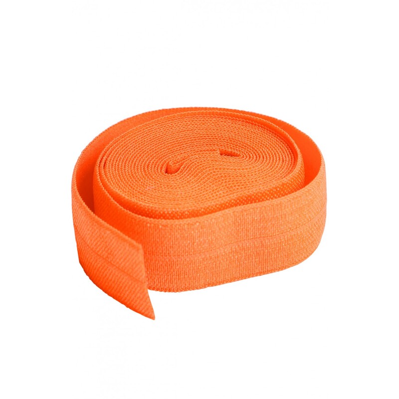 A circular roll of bright orange elastic, 3/4