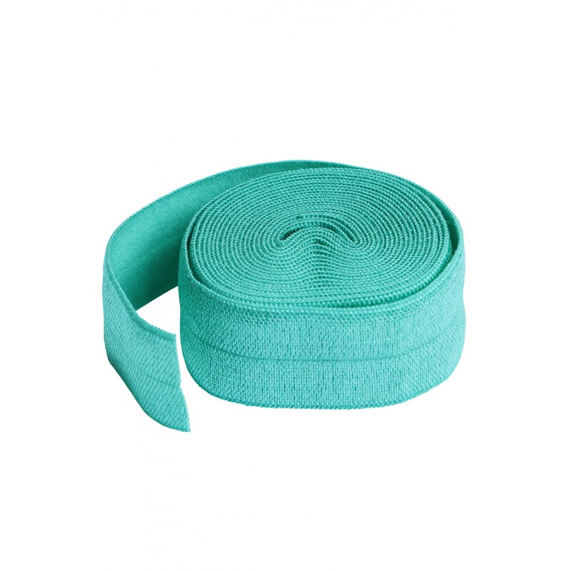 A circular roll of turquoise elastic, 3/4