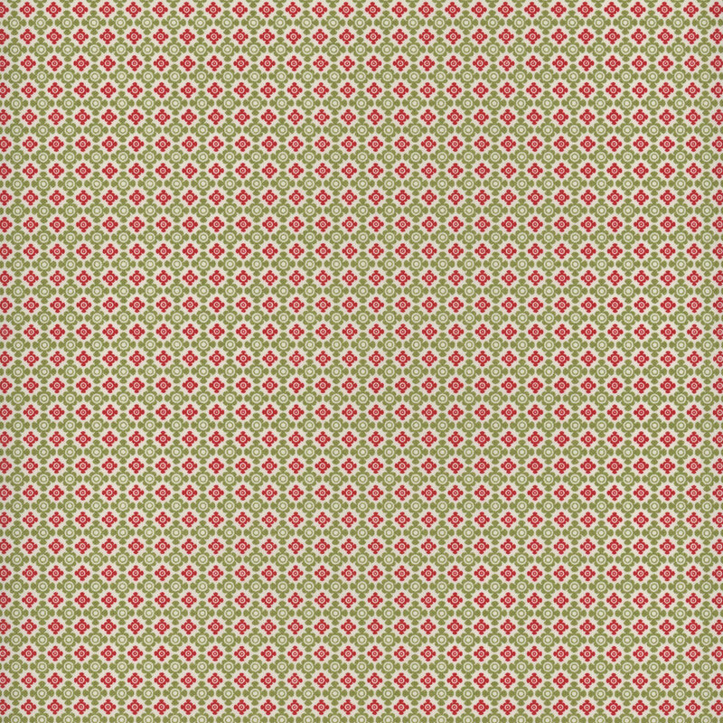 Green and red fabric with a visually interesting geometric pattern in a lattice-like pattern with rounded shapes against a cream background.