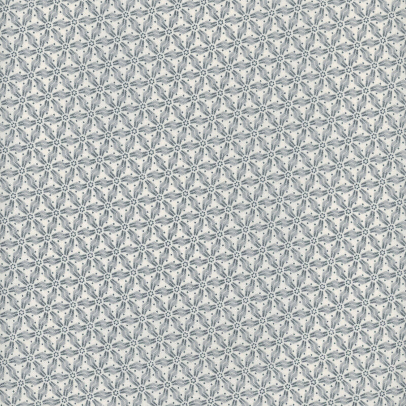 white fabric with a dusty blue mosaic pattern