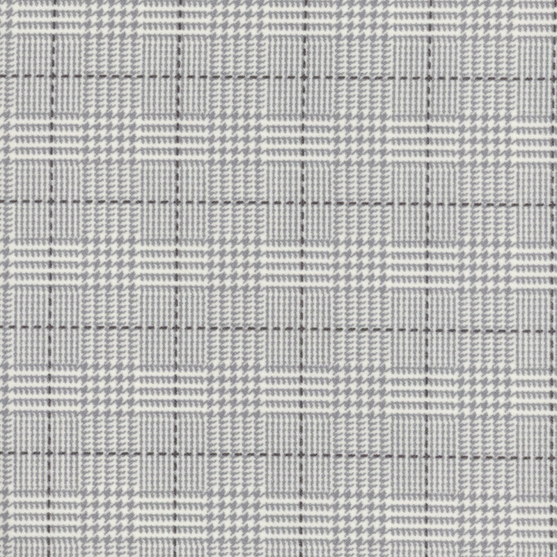 gray flannel fabric featuring a light gray plaid design, including dashed lines and houndstooth elements