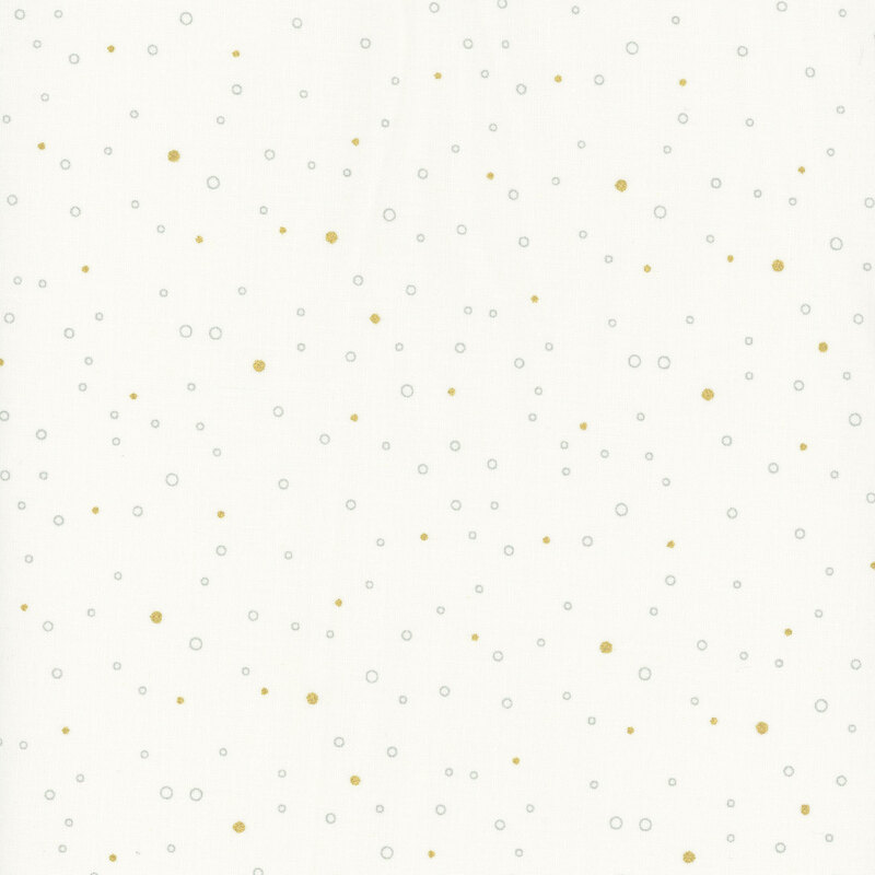 Cream fabric featuring tiny gray circles and gold metallic dots scattered all over.