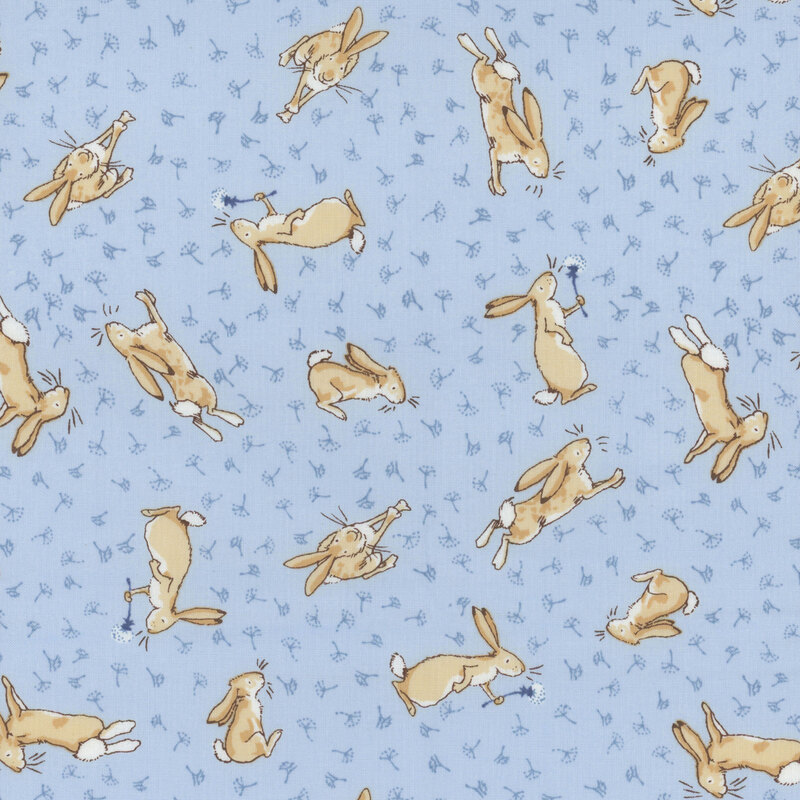 Blue fabric featuring tonal dandelion seeds and Little Nutbrown Hare chasing them all around.