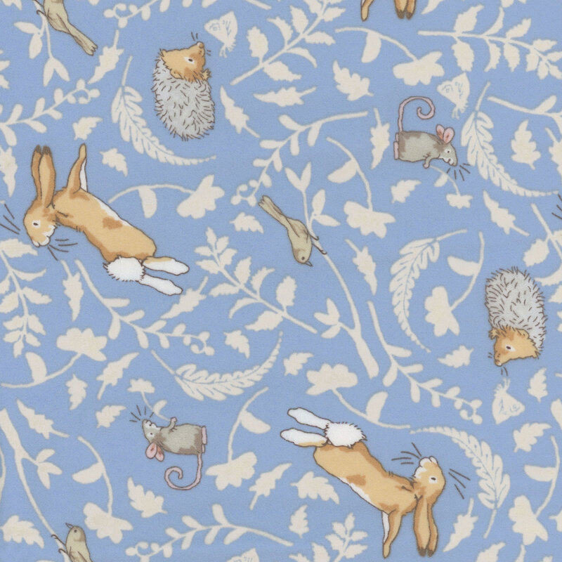 Blue fabric featuring tonal leaf silhouettes and joyful woodland animals in soft, neutral colors.