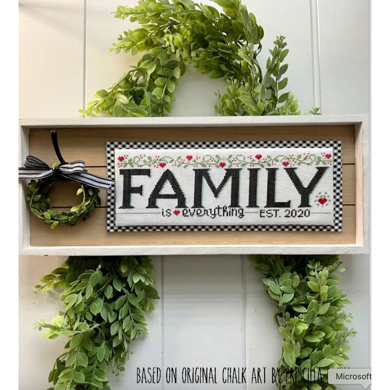 cross stitch design showing the completed project featuring the phrase "Family is everything EST 2020" with hearts and vines