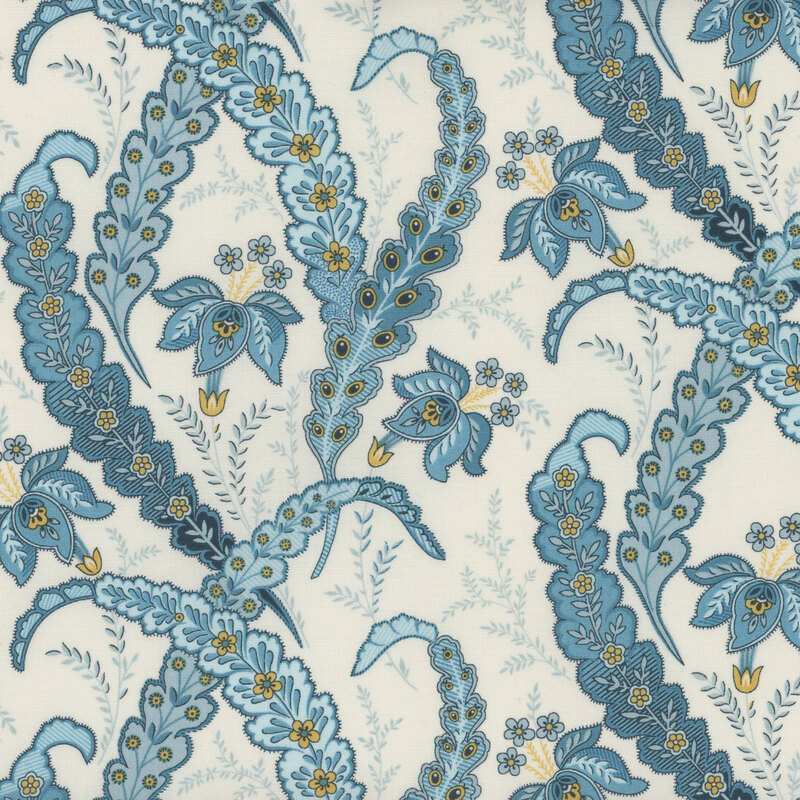 Cream-colored fabric with blue leaf and flower paisleys with yellow accents.