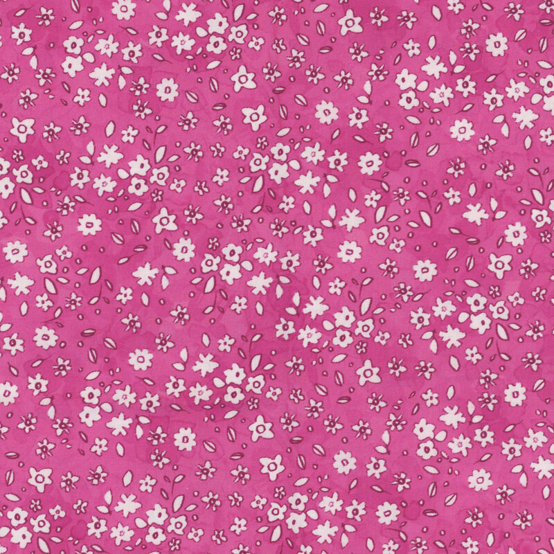 Pink fabric with a pattern of little white watercolor flowers.