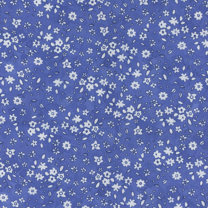 Purple fabric with a pattern of little white watercolor flowers.