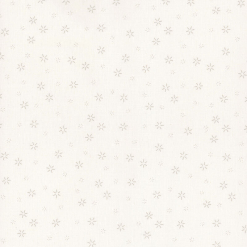 White fabric scattered with small simple flower motifs