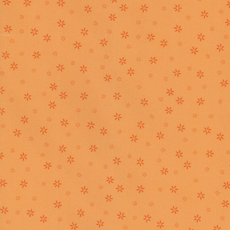 Orange fabric scattered with small simple flower motifs