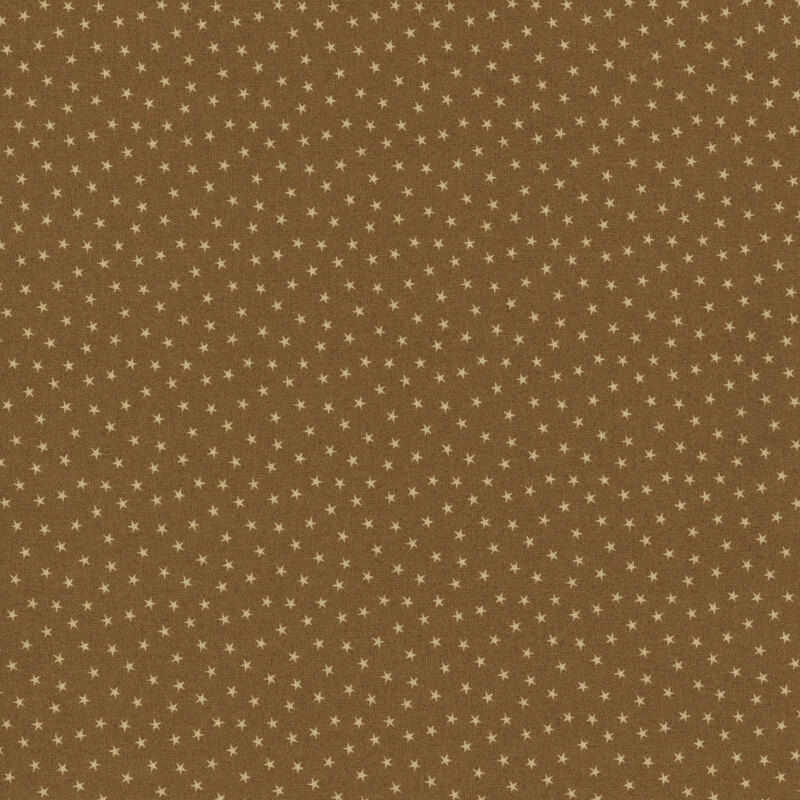 Peanut brown fabric with a pattern of tiny stars in a row