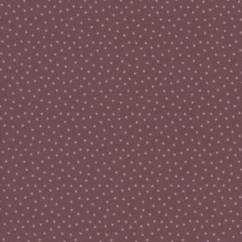 Mauve fabric with a pattern of tiny stars in a row