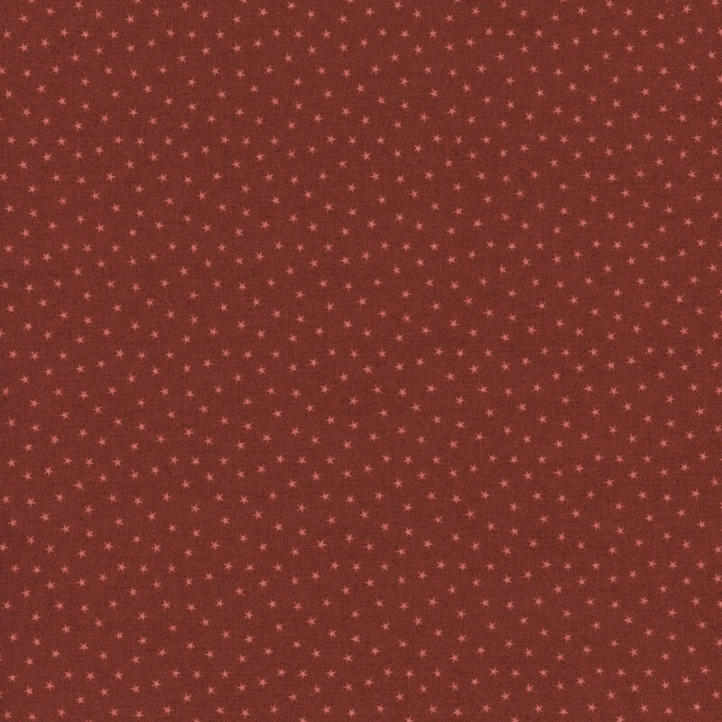 Ruby red fabric with a pattern of tiny stars in a row