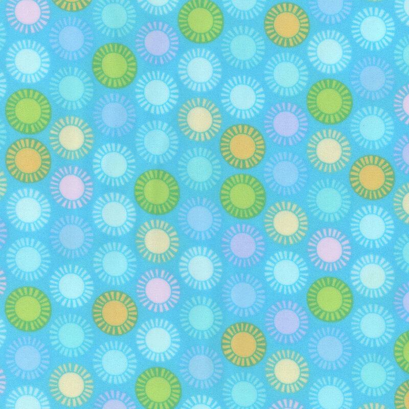 aqua fabric featuring colorful suns