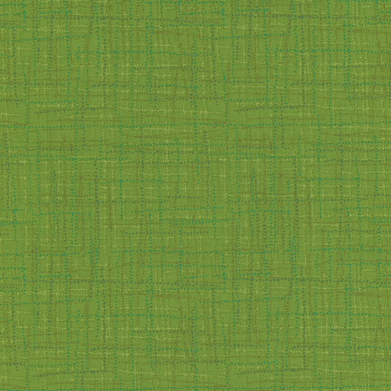 A textured green fabric background with subtle variations in shade and pattern.