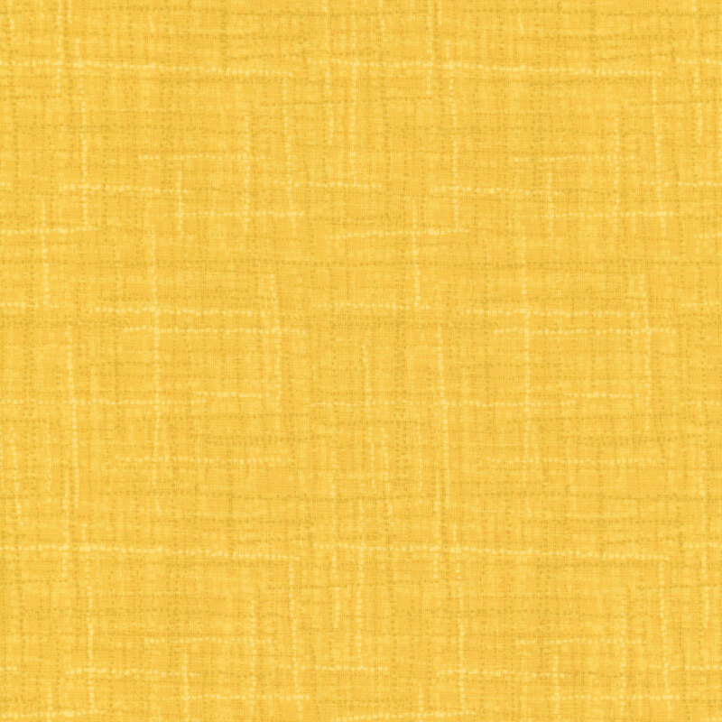 A textured yellow fabric background with a subtle pattern.