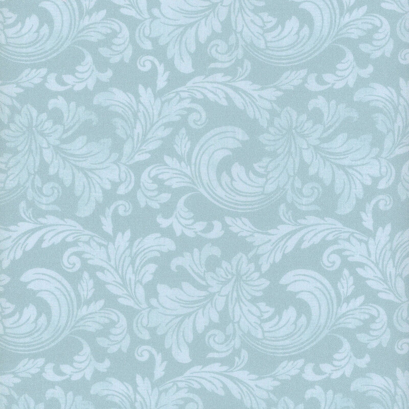 Fabric with a pattern of swirling light blue acanthus leaves on a blue background.