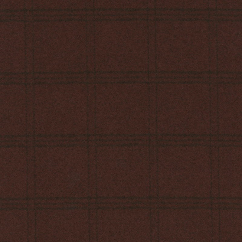 Deep red flannel fabric with darker tartan plaid patterning