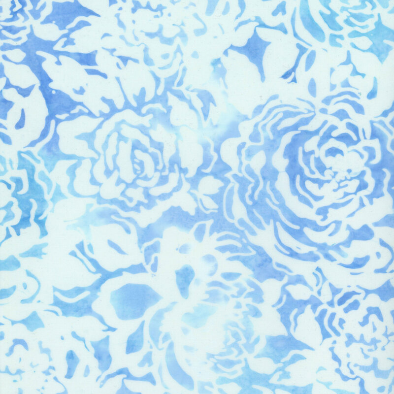 Blue mottled fabric with white rose silhouettes all over