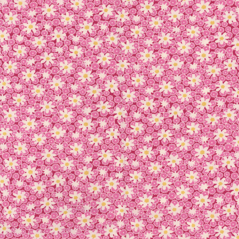 Pink fabric with floral pattern of small pink flowers and white daisies.