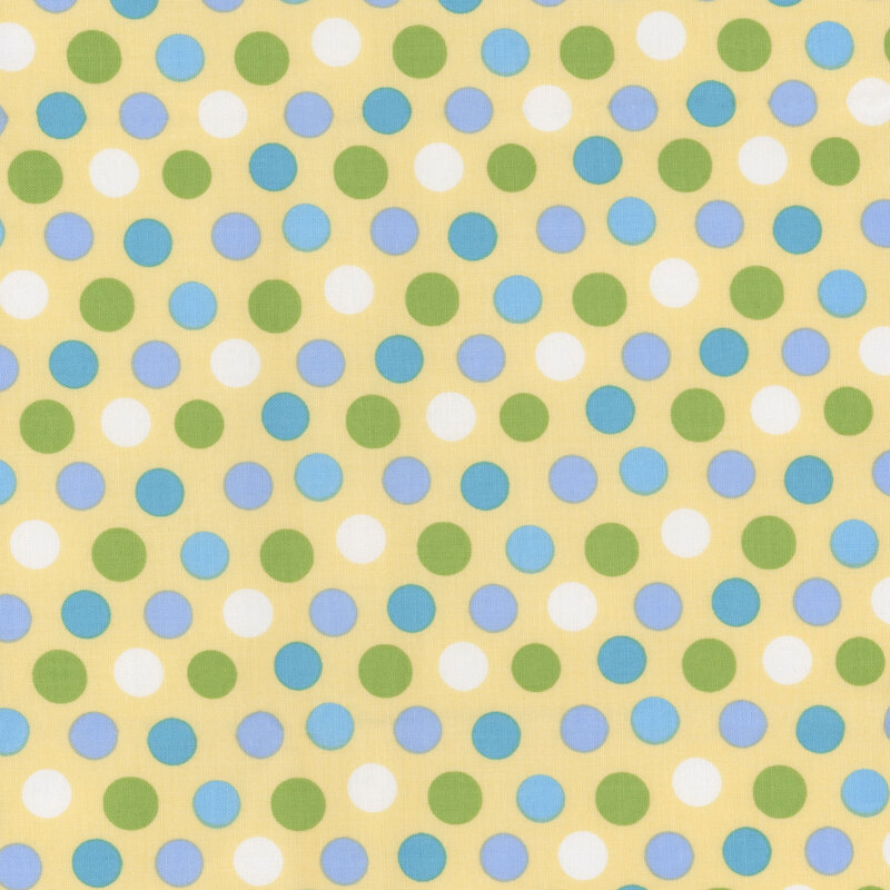 Yellow fabric with blue, green, and white polka dots.