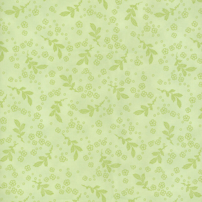 Vivid green fabric with light green leaf sprigs and small flowers.