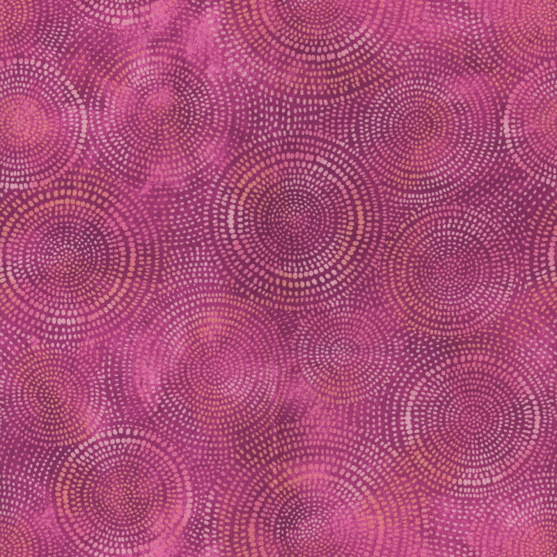 Photo of purple mottled fabric with lighter tonal rings made up of tiny dashes