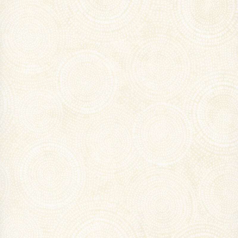 Photo of cream mottled fabric with lighter tonal rings made up of tiny dashes