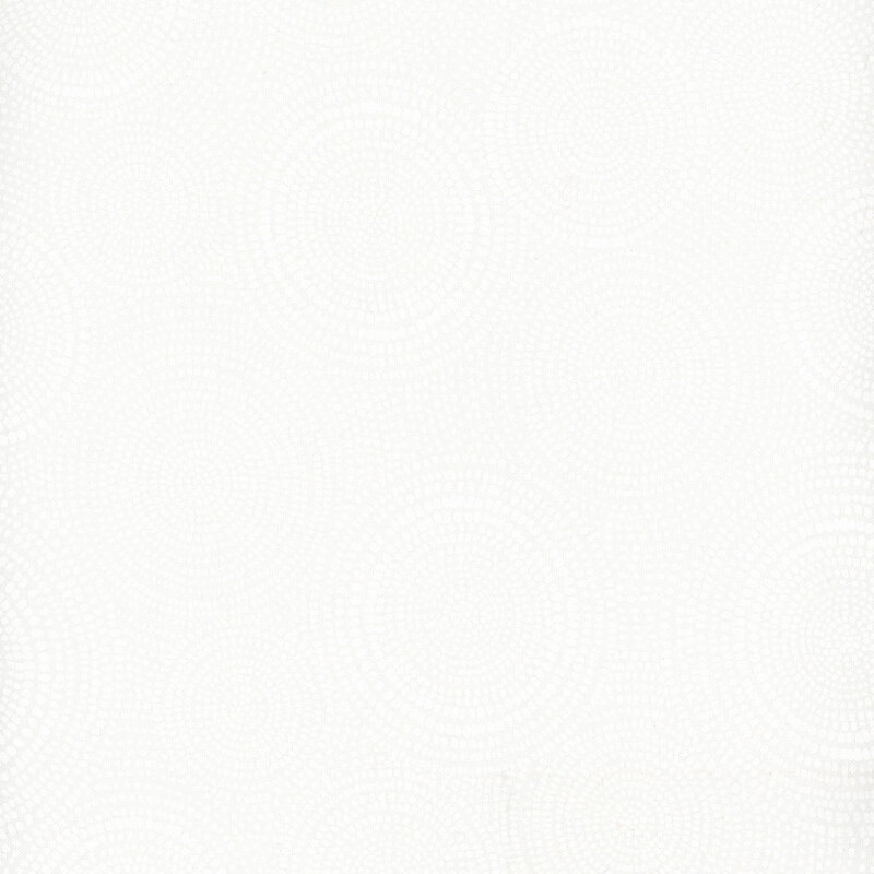 Photo of cream mottled fabric with lighter tonal rings made up of tiny dashes