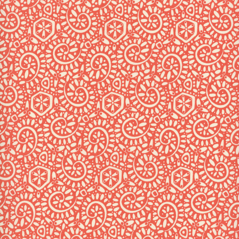 Red salmon fabric with a packed pattern of cream-colored ammonite swirls and dots.