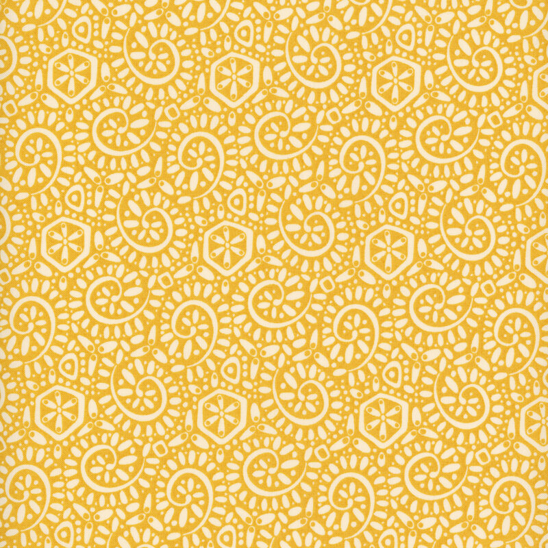 Yellow fabric with a packed pattern of cream-colored ammonite swirls and dots.