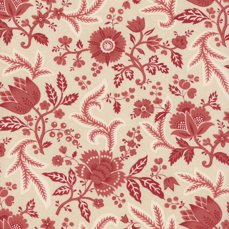 Cream fabric featuring a red floral design with leaves and vines