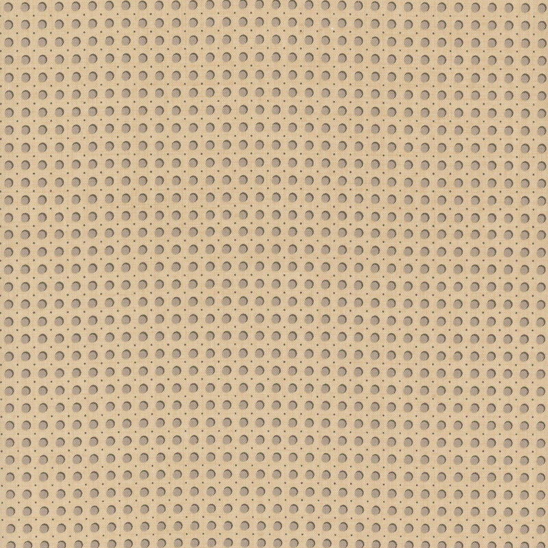 dark cream fabric featuring gray dots