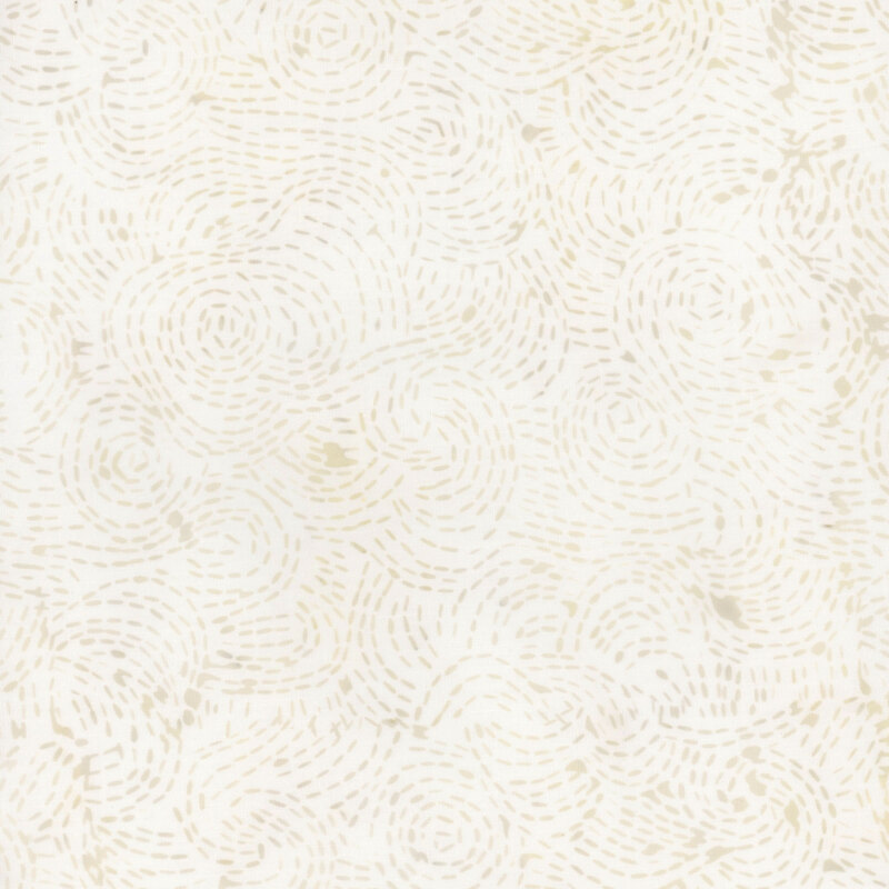 Cream fabric with a swirled and dotted design