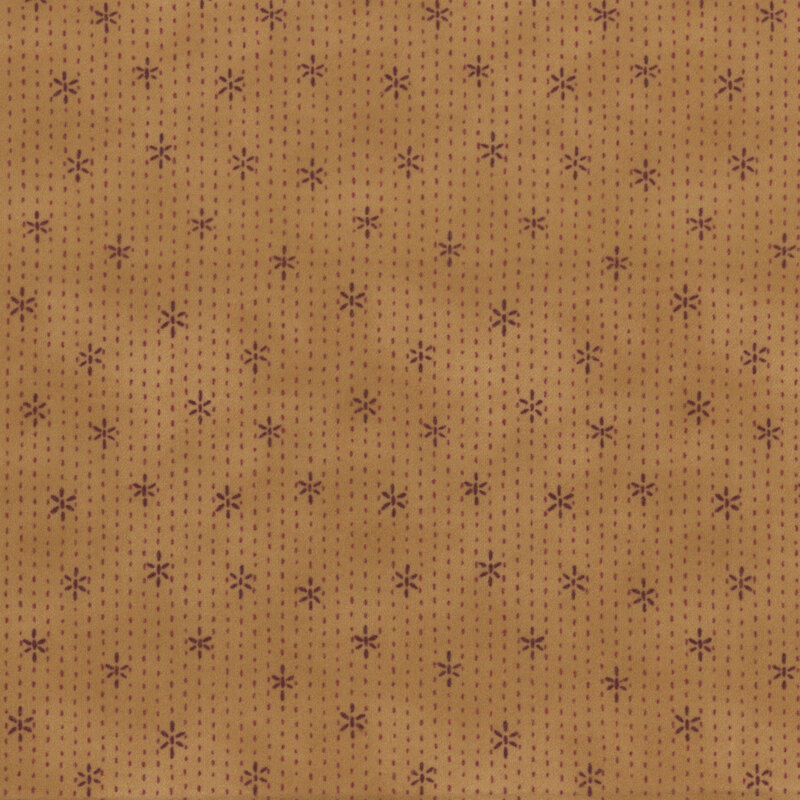 golden yellow fabric featuring stitches and stars