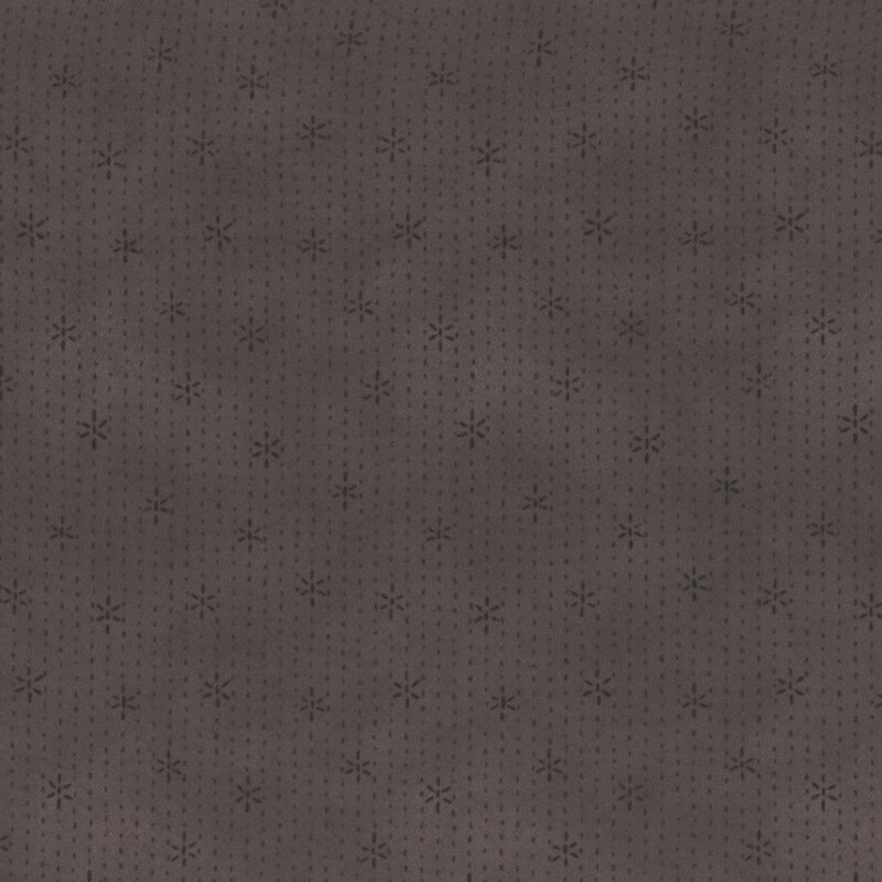 dusty eggplant gray fabric featuring stitches and stars