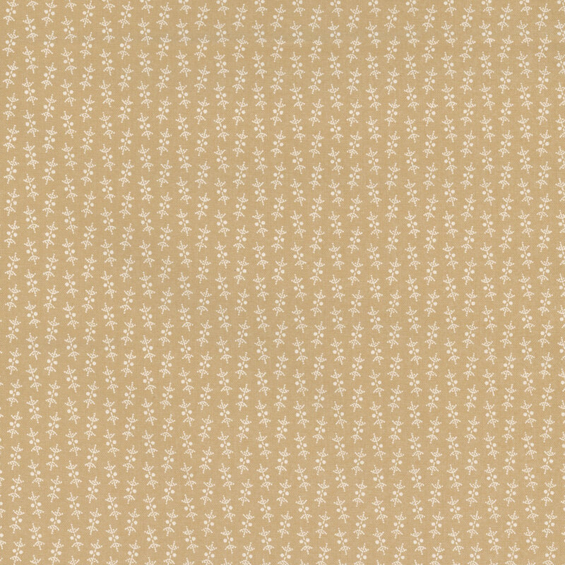 Light tan fabric with small alternating floral decorations