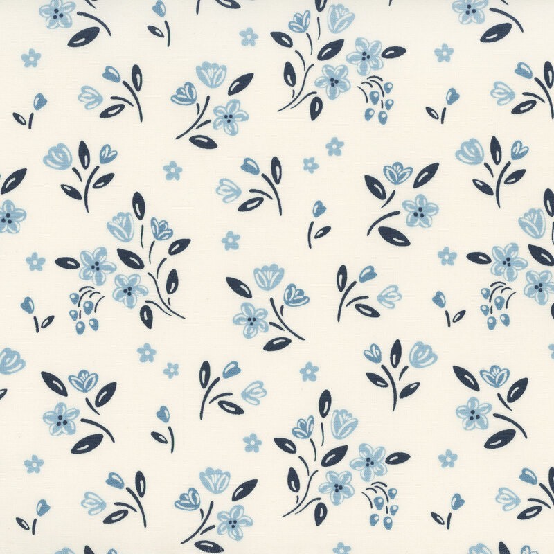 Light cream fabric featuring ditsy floral bunches with navy blue stems and light blue flowers