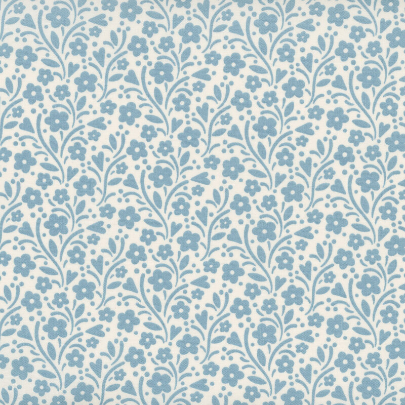 Light cream fabric with light blue leaves, vines, and florals all over