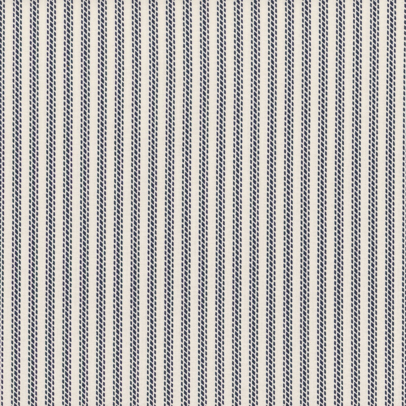 Light cream fabric with small blue dotted stripes