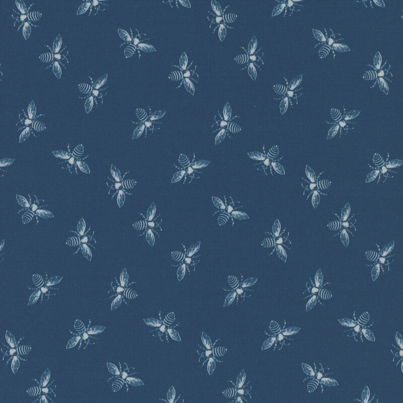 Navy blue fabric with light cream ditsy bees all over.