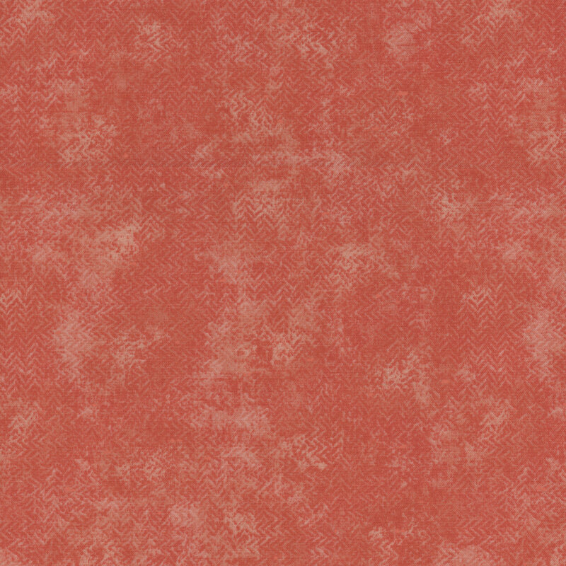 A mottled coral fabric with a textured, zig zag look