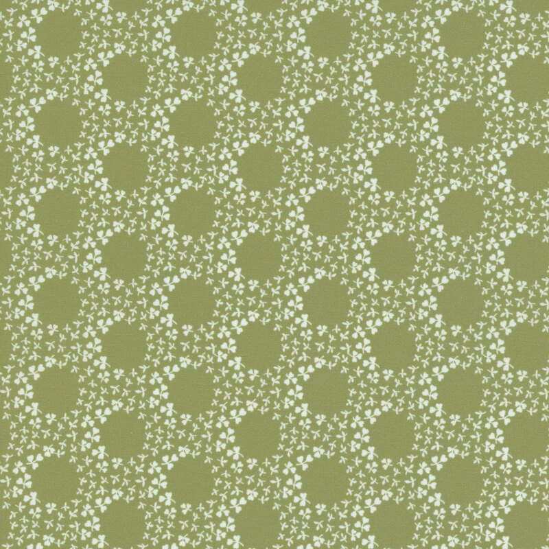 A grass-green fabric with rings of white clovers.