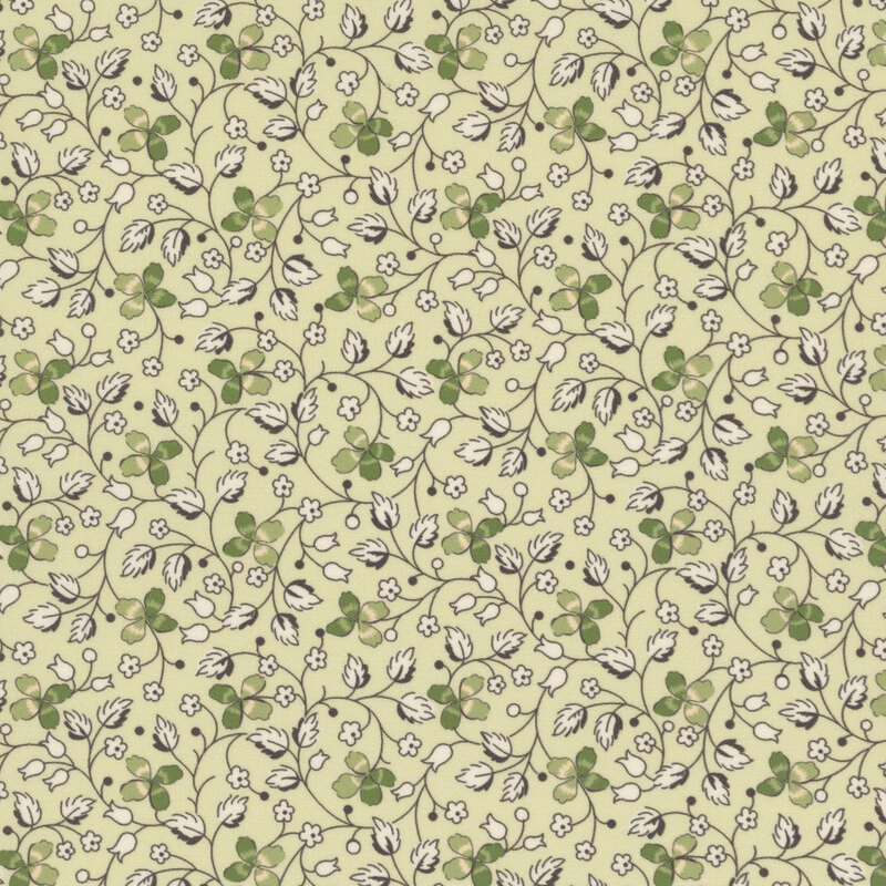 Light green fabric with creeping vines, leaves, and clovers throughout.