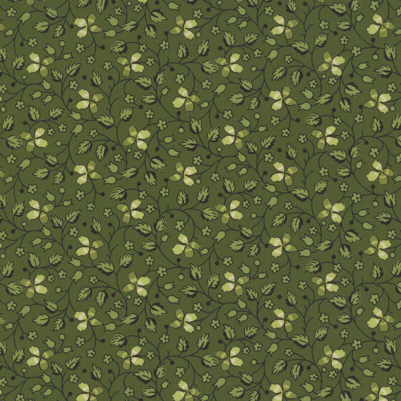 Green fabric with creeping vines, florals, and clover throughout.