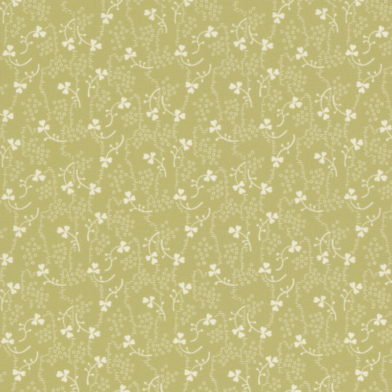 Pale green fabric with small white shamrocks and vines scattered throughout.