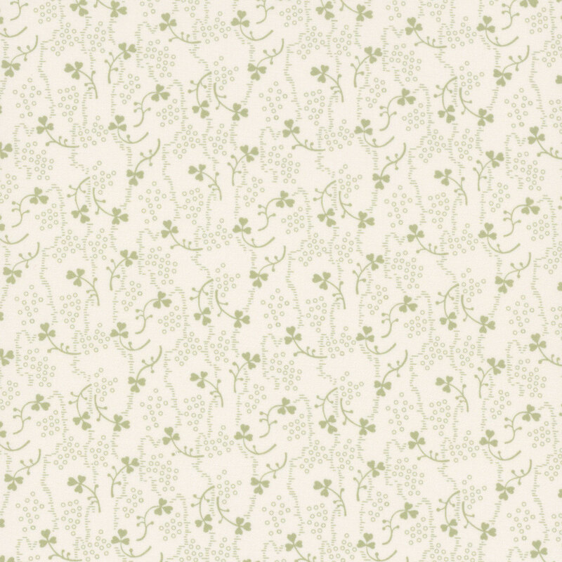 Light cream fabric with small green shamrocks and vines scattered throughout.