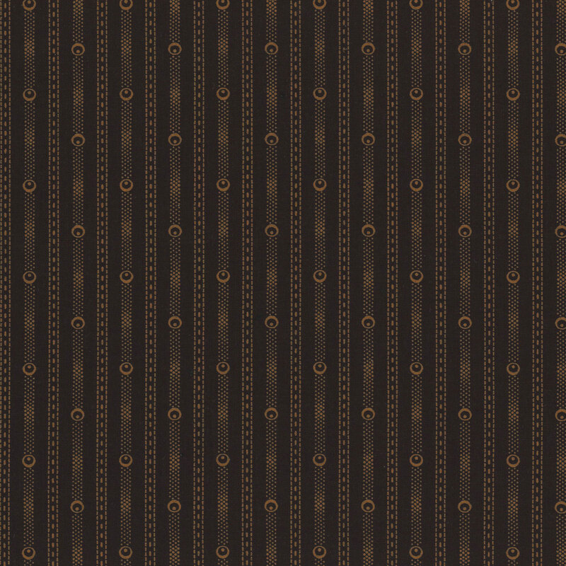 Black fabric with tan stripes made of dashed lines and circular shapes