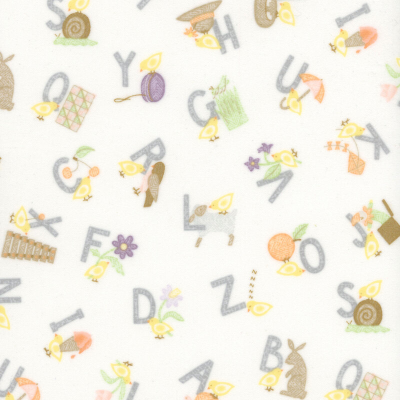 soft white fabric featuring the alphabet with corresponding images for each letter.