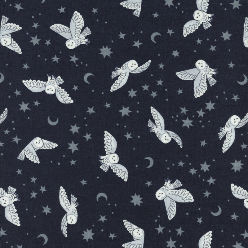 dark blue fabric featuring owls, star, and moons